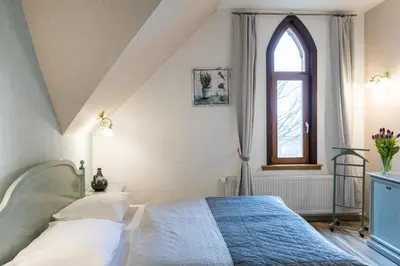 Ein Bett oder Betten in einem Zimmer der Unterkunft Schlossberg Hotel Wernigerode