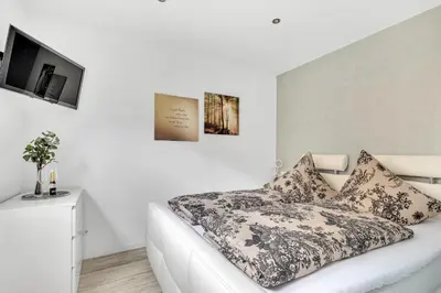 Ein Bett oder Betten in einem Zimmer der Unterkunft Ferienwohnung Blickfang am Nordberg