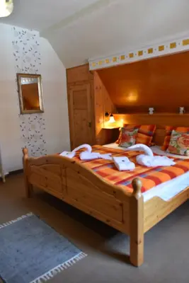 Ein Bett oder Betten in einem Zimmer der Unterkunft Hotel-Pension Teutonia