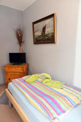 Ein Bett oder Betten in einem Zimmer der Unterkunft Hotel-Pension Teutonia