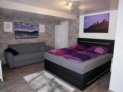 Ein Bett oder Betten in einem Zimmer der Unterkunft Ferienwohnung Sagenwelt