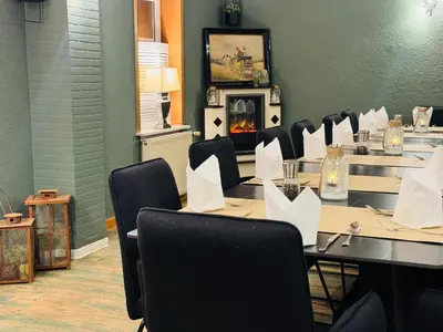 Ein Restaurant oder anderes Speiselokal in der Unterkunft Harzhotel Warnstedter Krug