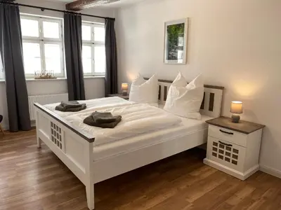 Ein Bett oder Betten in einem Zimmer der Unterkunft Zum Mathildenbrunnen