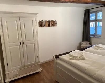Ein Bett oder Betten in einem Zimmer der Unterkunft Zum Mathildenbrunnen