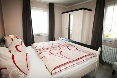 Ein Bett oder Betten in einem Zimmer der Unterkunft Ferienhaus SweetHome