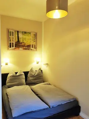 Ein Bett oder Betten in einem Zimmer der Unterkunft Ferienwohnung Himmelpforte 2