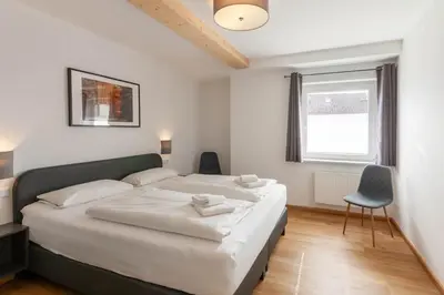 Ein Bett oder Betten in einem Zimmer der Unterkunft Ferienhaus Wanderzeit mit Sauna, Garten und Grill
