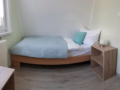 Ein Bett oder Betten in einem Zimmer der Unterkunft Harzer Finnhütte