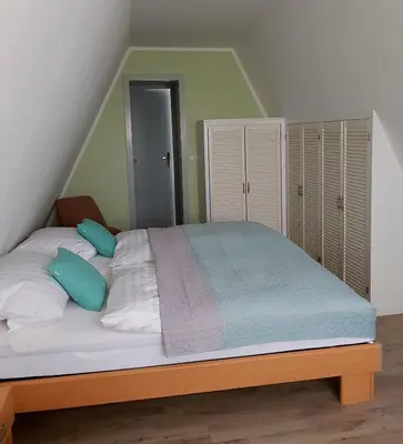Ein Bett oder Betten in einem Zimmer der Unterkunft Harzer Finnhütte