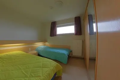 Ein Bett oder Betten in einem Zimmer der Unterkunft Apartment 480
