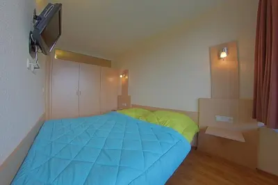 Ein Bett oder Betten in einem Zimmer der Unterkunft Apartment 551