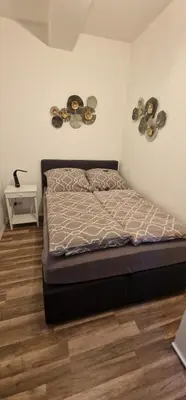 Ein Bett oder Betten in einem Zimmer der Unterkunft Manu's Appartements