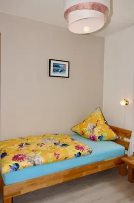 Ein Bett oder Betten in einem Zimmer der Unterkunft Ferienwohnung Ostard 1