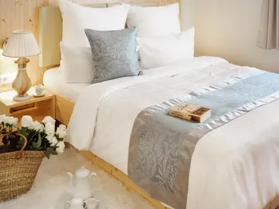 Ein Bett oder Betten in einem Zimmer der Unterkunft REGIOHOTEL Germania Bad Harzburg - #DirektAmKurpark #Wellnessbereich #Frühstücksbuffet #FreeParking