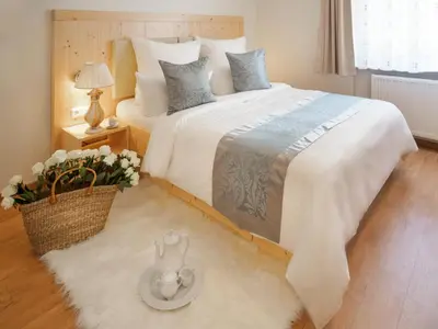 Ein Bett oder Betten in einem Zimmer der Unterkunft REGIOHOTEL Germania Bad Harzburg - #DirektAmKurpark #Wellnessbereich #Frühstücksbuffet #FreeParking