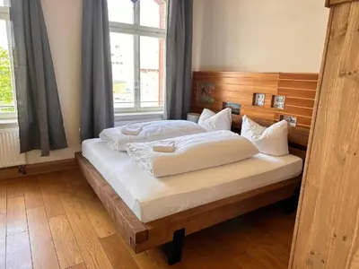 Ein Bett oder Betten in einem Zimmer der Unterkunft Altstadthotel Ilsenburg
