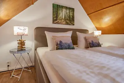 Ein Bett oder Betten in einem Zimmer der Unterkunft Hotel Schlossblick