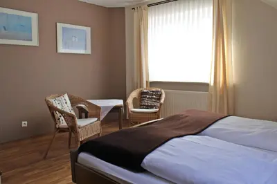 Ein Bett oder Betten in einem Zimmer der Unterkunft Ulrichshof