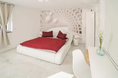 Ein Bett oder Betten in einem Zimmer der Unterkunft Designapartments Sweet Home - Sennhütte 11