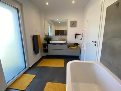 Ein Bett oder Betten in einem Zimmer der Unterkunft Ferienhäuser Unikat A&B
