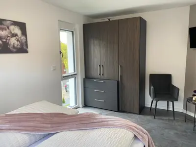 Ein Bett oder Betten in einem Zimmer der Unterkunft Ferienhäuser Unikat A&B