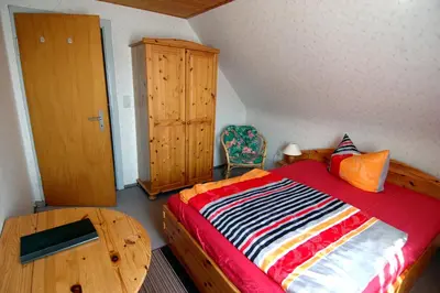 Ein Bett oder Betten in einem Zimmer der Unterkunft Wiedaer Hütte