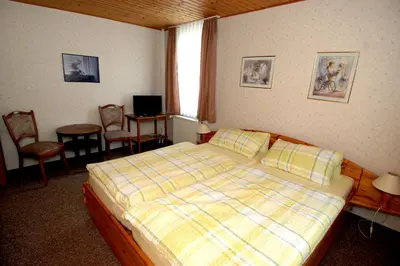 Ein Bett oder Betten in einem Zimmer der Unterkunft Wiedaer Hütte