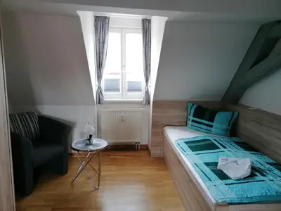 Ein Bett oder Betten in einem Zimmer der Unterkunft Ferienwohnung Neuer Weg 15