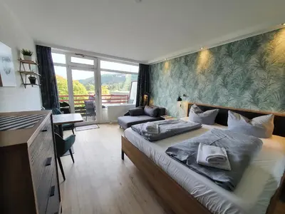 Ein Bett oder Betten in einem Zimmer der Unterkunft Harz Style - Vier Jahreszeiten