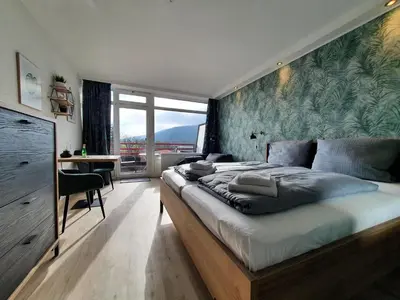 Ein Bett oder Betten in einem Zimmer der Unterkunft Harz Style - Vier Jahreszeiten