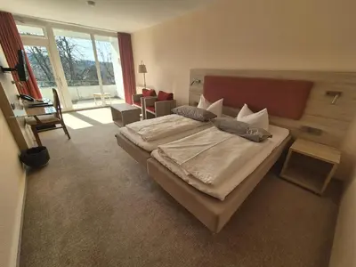 Ein Bett oder Betten in einem Zimmer der Unterkunft Hotel Hahnenkleer Hof