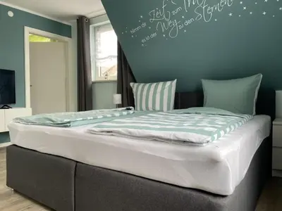 Ein Bett oder Betten in einem Zimmer der Unterkunft Ferienhaus BellaVita