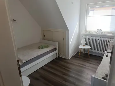 Ein Bett oder Betten in einem Zimmer der Unterkunft Ferienwohnung Harz Valley -Mit Fernblick in den Harz.