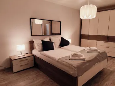 Ein Bett oder Betten in einem Zimmer der Unterkunft ApartZ - Bad Harzburg - Apartment mit Sauna in idealer Lage mit Bergblick