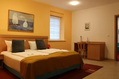 Ein Bett oder Betten in einem Zimmer der Unterkunft Waldhotel Harz Ilsenburg