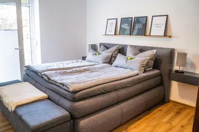 Ein Bett oder Betten in einem Zimmer der Unterkunft 4 Sterne Ferienwohnung , 65 qm