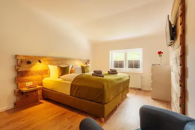 Ein Bett oder Betten in einem Zimmer der Unterkunft Schlufter Wiese