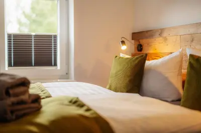 Ein Bett oder Betten in einem Zimmer der Unterkunft Schlufter Wiese