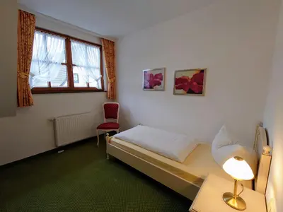 Ein Bett oder Betten in einem Zimmer der Unterkunft Landhausferienwohnungen Am Brockenblick