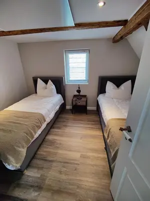 Ein Bett oder Betten in einem Zimmer der Unterkunft Tolles schönes Ferienhaus mit großer Grillterrasse für 12 Personen im Harz