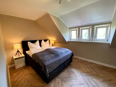 Ein Bett oder Betten in einem Zimmer der Unterkunft Ferienwohnung Gipfelstürmer