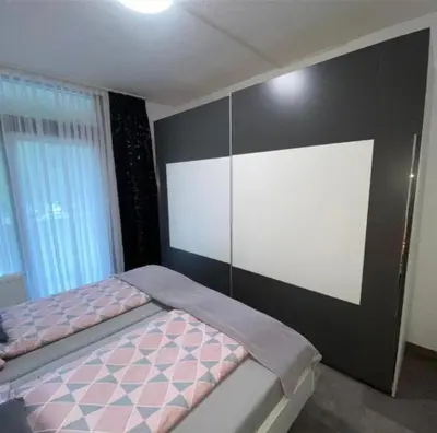 Ein Bett oder Betten in einem Zimmer der Unterkunft International 6