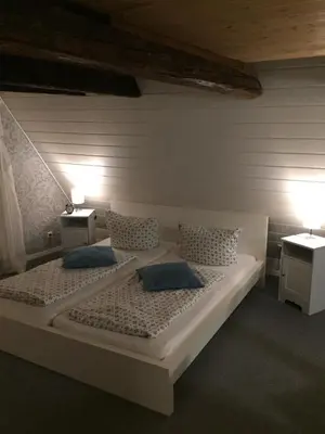 Ein Bett oder Betten in einem Zimmer der Unterkunft Himmel & Hölle