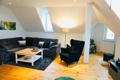 Ein Sitzbereich in der Unterkunft FeWo26 im Sagenharz - stilvolles Family-Apartment, 2 SZ, Klimaanlage, WLAN, Netflix & Free Parking