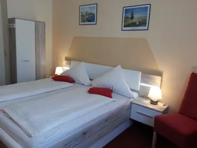 Ein Bett oder Betten in einem Zimmer der Unterkunft Villa HarzFokus - #Hotel#Pension#Frühstück