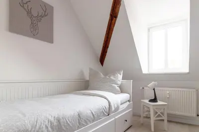 Ein Bett oder Betten in einem Zimmer der Unterkunft Ferienwohnungen im Weingarten Quedlinburg