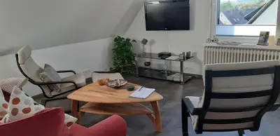 Ein Sitzbereich in der Unterkunft Ferienwohnung Harzer Wolf in Goslar/Sudmerberg