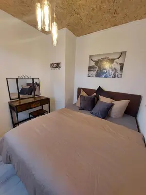 Ein Bett oder Betten in einem Zimmer der Unterkunft Ferienwohnung Alpakahof Goslar