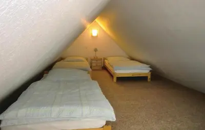 Ein Bett oder Betten in einem Zimmer der Unterkunft Ferienhaus Harzstrasse Q