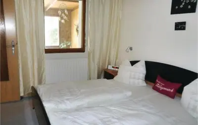 Ein Bett oder Betten in einem Zimmer der Unterkunft Ferienhaus Albertine D